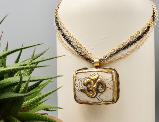 tibetan om amulet ~ naga shell necklace